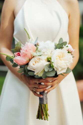 Beautiful wedding bouquet in hands of the bride